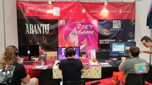 Estand de la incubadora de videojocs GameGi d'El Modern al SAGA Barcelona Game Fest amb jugadors provant els jocs